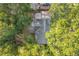 Aerial view showcasing the roof and backyard surrounded by lush greenery and mature trees at 2509 Formosa Ave, Orlando, FL 32804
