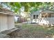 View of the backyard featuring a detached garage and partial fencing for added privacy at 2509 Formosa Ave, Orlando, FL 32804