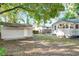Large backyard with detached garage and home exterior, perfect for outdoor living at 2509 Formosa Ave, Orlando, FL 32804