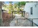 Fenced backyard featuring a covered carport and mature landscaping at 2509 Formosa Ave, Orlando, FL 32804