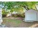 Spacious backyard with a detached garage and a mix of sun and shade at 2509 Formosa Ave, Orlando, FL 32804