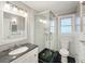 Well-lit bathroom featuring a glass shower and a sleek vanity with a dark countertop at 2509 Formosa Ave, Orlando, FL 32804