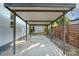 Spacious carport providing covered parking with view of the yard and fence at 2509 Formosa Ave, Orlando, FL 32804