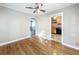 Open-concept living room features hardwood floors, neutral paint, and flows into the kitchen at 2509 Formosa Ave, Orlando, FL 32804