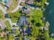Stunning aerial view showcasing the property's lush landscaping and private pool with lake access at 2922 Carmia Dr, Orlando, FL 32806