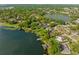 Stunning aerial shot of lakefront properties surrounded by lush greenery and clear waters at 2922 Carmia Dr, Orlando, FL 32806