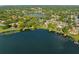 Expansive aerial view of homes nestled along a serene lakefront community, surrounded by lush greenery at 2922 Carmia Dr, Orlando, FL 32806