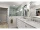 A luxurious bathroom features a double sink vanity and decorative tiled glass shower enclosure at 2922 Carmia Dr, Orlando, FL 32806