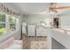Bright bedroom with a large window, neutral decor, and a ceiling fan at 2922 Carmia Dr, Orlando, FL 32806
