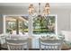 Charming dining area with views of the screened pool and waterfall feature at 2922 Carmia Dr, Orlando, FL 32806