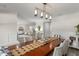 An inviting dining room showcases a wood table and views to the open living area at 2922 Carmia Dr, Orlando, FL 32806