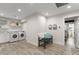 Well-lit laundry room with modern washer and dryer, floating shelves, and stylish decor at 2922 Carmia Dr, Orlando, FL 32806