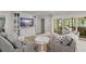 Bright living room featuring hardwood floors, a media center, and sliding glass doors at 2922 Carmia Dr, Orlando, FL 32806
