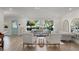 Bright living room boasting hardwood floors and large windows, blending indoor comfort with natural light at 2922 Carmia Dr, Orlando, FL 32806