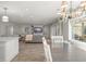 Bright open living space featuring updated finishes, hardwood flooring, and modern decor at 2922 Carmia Dr, Orlando, FL 32806