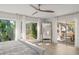 The main bedroom features abundant natural light, backyard views and sliding door to the pool at 2922 Carmia Dr, Orlando, FL 32806
