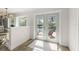 View from inside toward patio, pool, and lake through glass doors providing plenty of light at 2922 Carmia Dr, Orlando, FL 32806