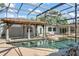 Relaxing pool area with covered tiki hut, and access to the main house at 2922 Carmia Dr, Orlando, FL 32806