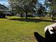 Expansive community green space with lush grass and mature trees, offering a serene and inviting atmosphere at 4251 Pinebark Ave # 17-3, Orlando, FL 32811