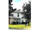 Charming two-story condo with a well-manicured lawn, lovely greenery and a welcoming entryway at 4251 Pinebark Ave # 17-3, Orlando, FL 32811