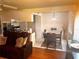 Cozy living and dining space with hardwood floors, an inviting seating area and a modern dining set at 4251 Pinebark Ave # 17-3, Orlando, FL 32811