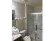 Bathroom featuring shower, toilet, vanity, with a neutral tile floor at 4573 Ada Ln, Kissimmee, FL 34746