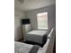 Bedroom featuring two beds, a dresser, a closet, and natural light at 4573 Ada Ln, Kissimmee, FL 34746