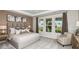 Serene main bedroom featuring plush bedding, stylish decor, and large windows at 4711 Coral Harbour Rd, Kissimmee, FL 34758