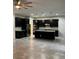 Spacious kitchen with dark cabinets, an island, stainless steel appliances, and recessed lighting at 4783 Riverwalk Dr, St Cloud, FL 34771