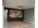 Open living room featuring tile floors, stylish ceiling fan, and a decorative accent wall at 4783 Riverwalk Dr, St Cloud, FL 34771