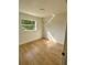 Bright bedroom featuring wood-look flooring and a window at 701 N 4Th St, Haines City, FL 33844