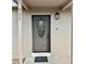The house features a gray front door with decorative glass, modern lighting and the house number, 701 at 701 N 4Th St, Haines City, FL 33844