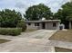 Cozy home with a neatly kept lawn, quaint landscaping, and a private driveway at 701 N 4Th St, Haines City, FL 33844