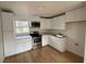 Modern kitchen with stainless steel appliances and white cabinets at 701 N 4Th St, Haines City, FL 33844