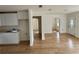 An open-concept living room with white cabinets and arched doorways at 701 N 4Th St, Haines City, FL 33844