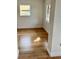 Bright living space features attractive flooring, neutral paint, and natural light from multiple windows at 701 N 4Th St, Haines City, FL 33844