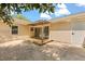 Backyard featuring a lattice-covered patio, wood deck, and mature landscaping near sliding glass door entrance at 704 Briarwood Dr, Winter Springs, FL 32708
