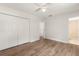 Spacious bedroom features wood-look flooring, a closet, and ensuite bathroom at 704 Briarwood Dr, Winter Springs, FL 32708