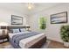 Comfortable primary bedroom with neutral decor, a large bed, and ambient lighting at 704 Briarwood Dr, Winter Springs, FL 32708