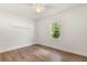 Bright bedroom features neutral walls, wood-look flooring, and natural light at 704 Briarwood Dr, Winter Springs, FL 32708
