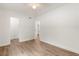 Spacious bedroom features wood-look flooring, and access to a bathroom at 704 Briarwood Dr, Winter Springs, FL 32708