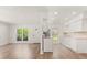 Open-concept living space blends the living room and kitchen areas seamlessly at 704 Briarwood Dr, Winter Springs, FL 32708