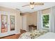 View of the bedroom featuring a double door closet, hardwood floors, and windows at 718 31St St, Orlando, FL 32805