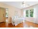 Bedroom with hardwood floors, white daybed, and three windows for natural light at 718 31St St, Orlando, FL 32805