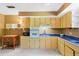 Functional kitchen featuring classic cabinetry and a bright, airy atmosphere at 718 31St St, Orlando, FL 32805