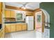 Efficient kitchen with a bright white refrigerator and ample cabinet storage at 718 31St St, Orlando, FL 32805