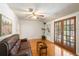 Living room featuring hardwood floors, a leather sofa, and French doors at 718 31St St, Orlando, FL 32805
