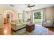 Cozy living room featuring hardwood floors, natural light, and comfortable seating arrangements at 718 31St St, Orlando, FL 32805