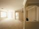 Expansive living room with neutral carpet, arched entryways, and bright natural light at 8276 Maritime Flag St # 201, Windermere, FL 34786