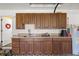 Spacious garage with abundant cabinetry, a sink, counter space, and plenty of storage at 8499 Se 155Th, Summerfield, FL 34491